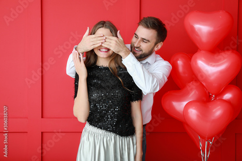 Happy young couple with hea...