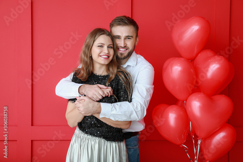 Happy young couple with hea...