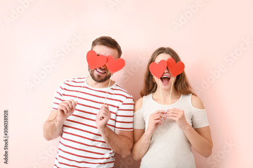 Happy young couple with red...