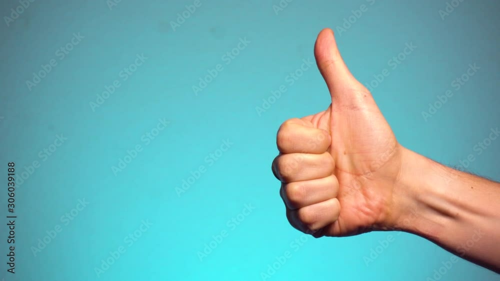 Gesture FINE. Hand of man with thumb up Gesture FINE. Hand of man with thumb up