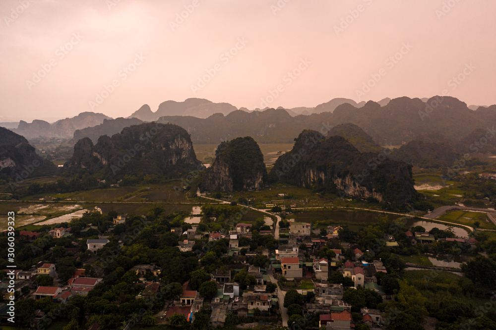 Obraz premium Aerial view of Tam Coc near Ninh Binh at sunset in Northern Vietnam, Asia.