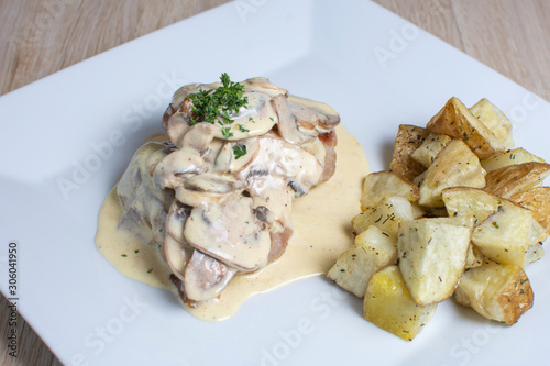 meat in mushroom sauce and french fries