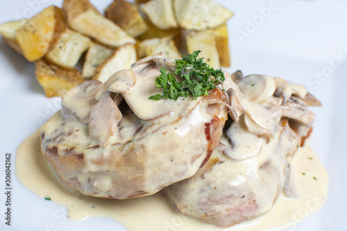 meat in mushroom sauce and french fries