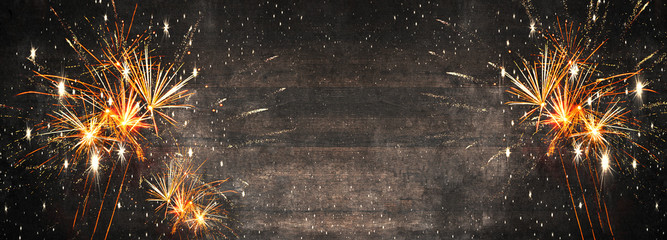 Silvester 2025, New Year's Eve,  New Year, new years eve background panorama long - Firework Fireworks on rustic brown wooden wood texture