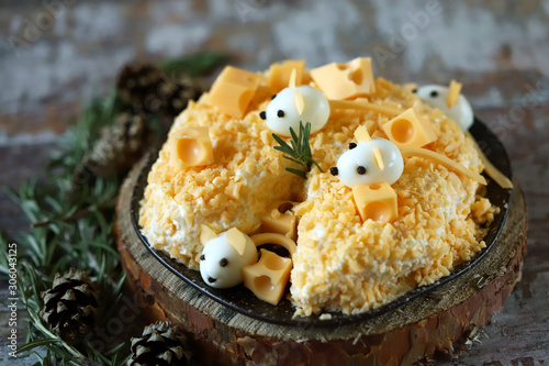 Funny salad for the new year 2020. Mouse in cheese salad. Christmas salad.