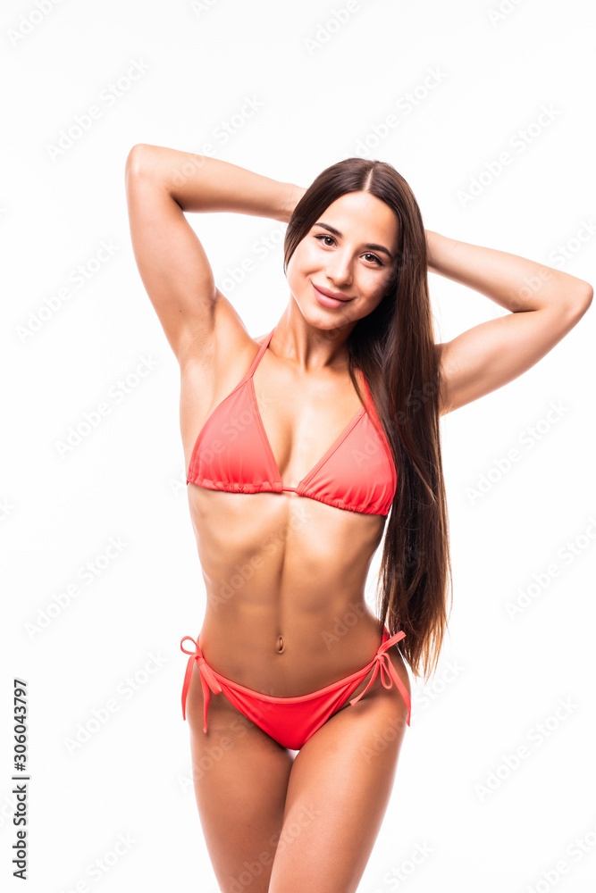 Sexy tan woman in red bikini isolated on white background
