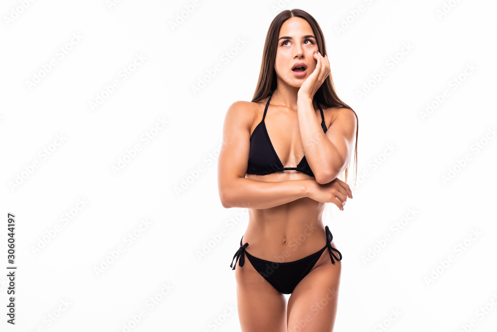 Fototapeta premium Pretty tanned woman in black bikini isolated on white background
