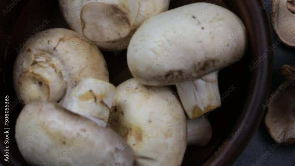 A panning shot of Button Mushrooms and Shiitake Mushrooms A panning shot of Button Mushrooms and Shiitake Mushrooms