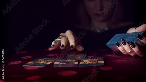 4k Mysterious Shot of Fortune Teller Placing on Table Tarot Cards