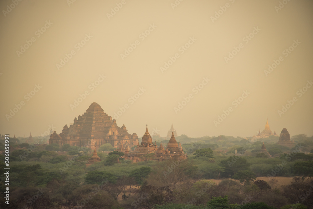Scenic sunrise with dusty smoke in Bagan Archaeological Zone(Dhammayangyi Temple) in Myanmar. Bagan is an ancient city located in the Mandalay, Myanmar