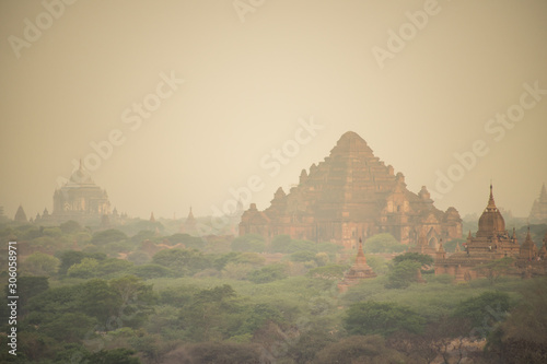 Scenic sunrise with dusty smoke in Bagan Archaeological Zone Dhammayangyi Temple  in Myanmar. Bagan is an ancient city located in the Mandalay  Myanmar