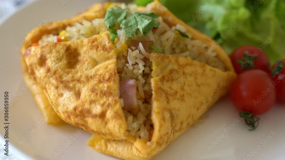 Flavored Fried Rice in an Omelet Wrapping Flavored Fried Rice in an Omelet Wrapping