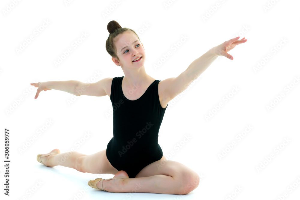 The gymnast perform an acrobatic element on the floor. The gymnast perform an acrobatic element on the floor.