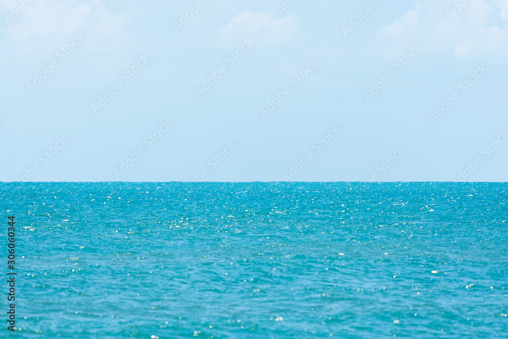 Beautiful seascape view with blue sky and clouds. Selective focus wallpaper.