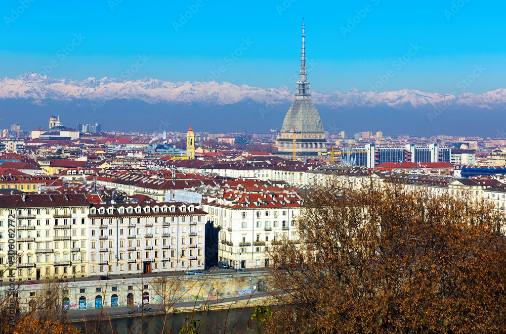 Turin cityscape with old buildings and mountains, Italy