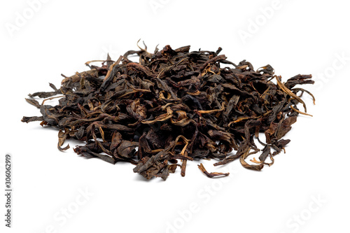 Dried fermented tea leaves stacked isolated on a white background.