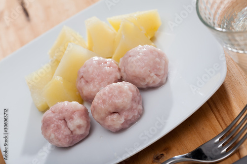 Close up of tasty steamed meatballs with boiled potatoes