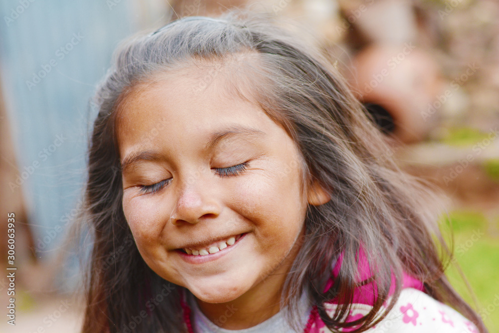 Happy latin kid with closed eyes. Happy latin kid with closed eyes.