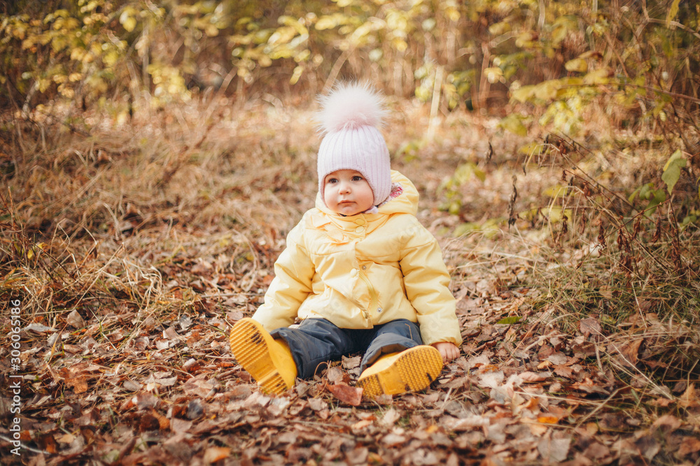 child funs in the woods. autumn park. The concept of fashion, accessories, outdoor walks child funs in the woods. autumn park. The concept of fashion, accessories, outdoor walks