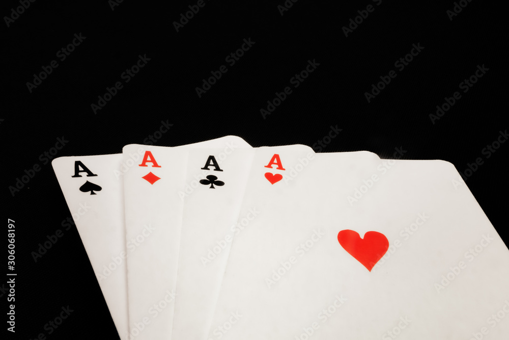 four aces on black background