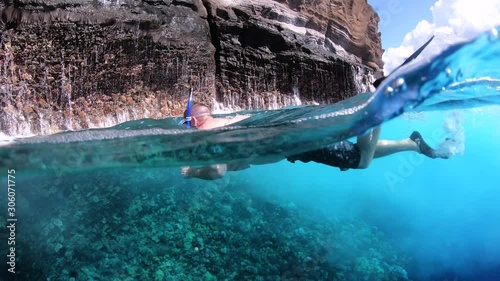 man snorkeling in the sea