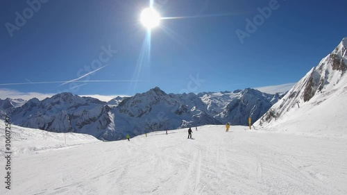Ponte di Legno, Tonale, Italy. Skiing on the slopes in a wonderful day. POV from the skier. Point of view from the ski helmet. Italian Alps