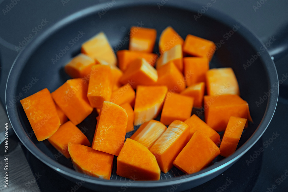 Sliced carrots on a teflon pan. Close view Sliced carrots on a teflon pan. Close view