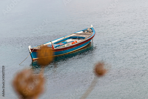 Wooden fishing boat on water.