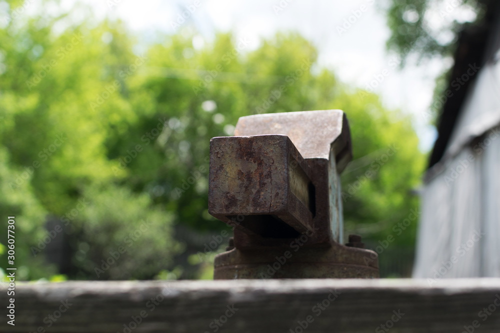 Rusty parts of woodworking machine on blurred background Rusty parts of woodworking machine on blurred background