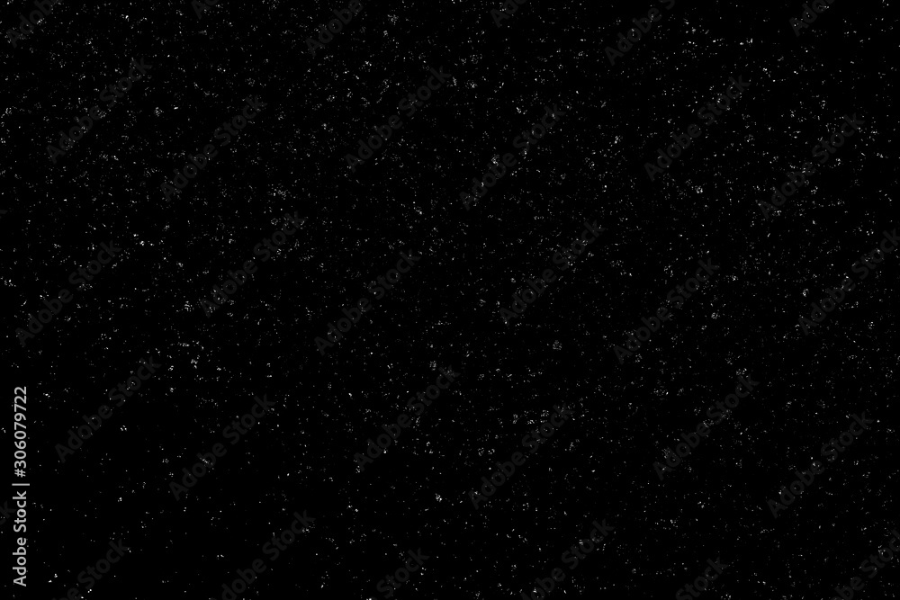 WHITE BOKEH ON A BLACK BACKGROUND. LIGHT SPOTS TEXTURE. FALLING SNOW. STAR SKY. WHITE BOKEH ON A BLACK BACKGROUND. LIGHT SPOTS TEXTURE. FALLING SNOW. STAR SKY.