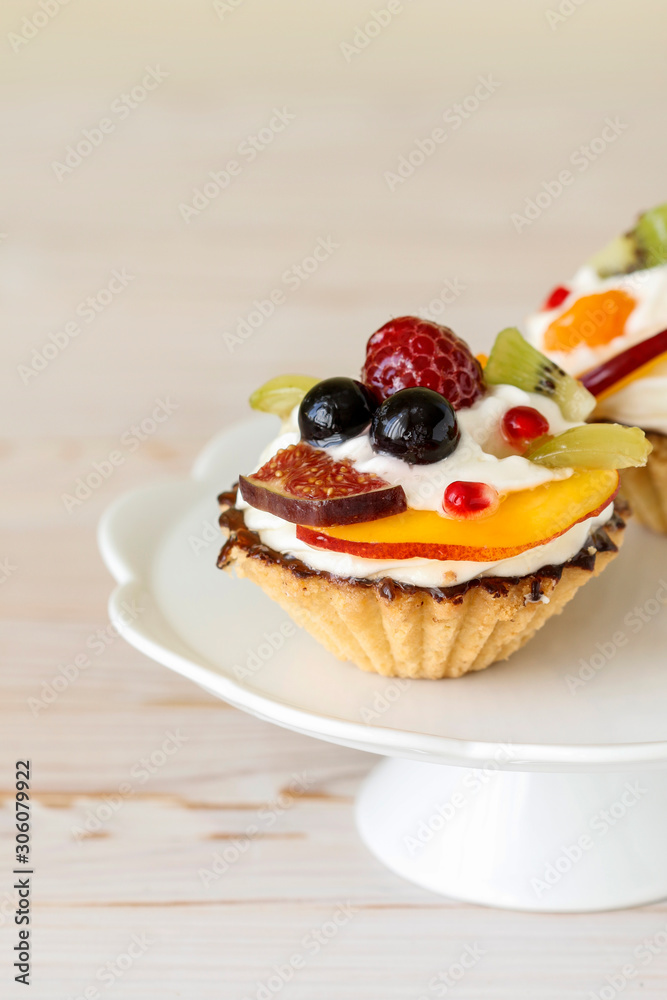 Colorful cupcakes with fresh fruits. Colorful cupcakes with fresh fruits.