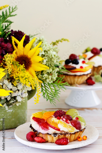 Colorful cupcakes with fresh fruits.