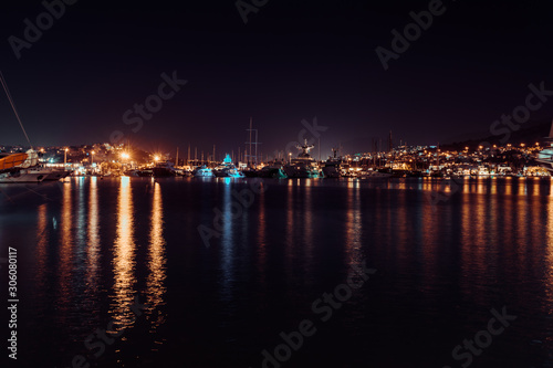 Night view of port of Bodrum. Lights of the city and reflection in water, Bodrum, Turkey