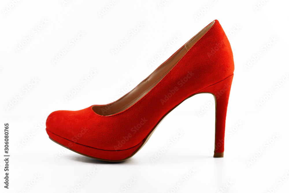 Side view of single elegant red synthetic suede leather high heel woman shoe isolated on white background Side view of single elegant red synthetic suede leather high heel woman shoe isolated on white background