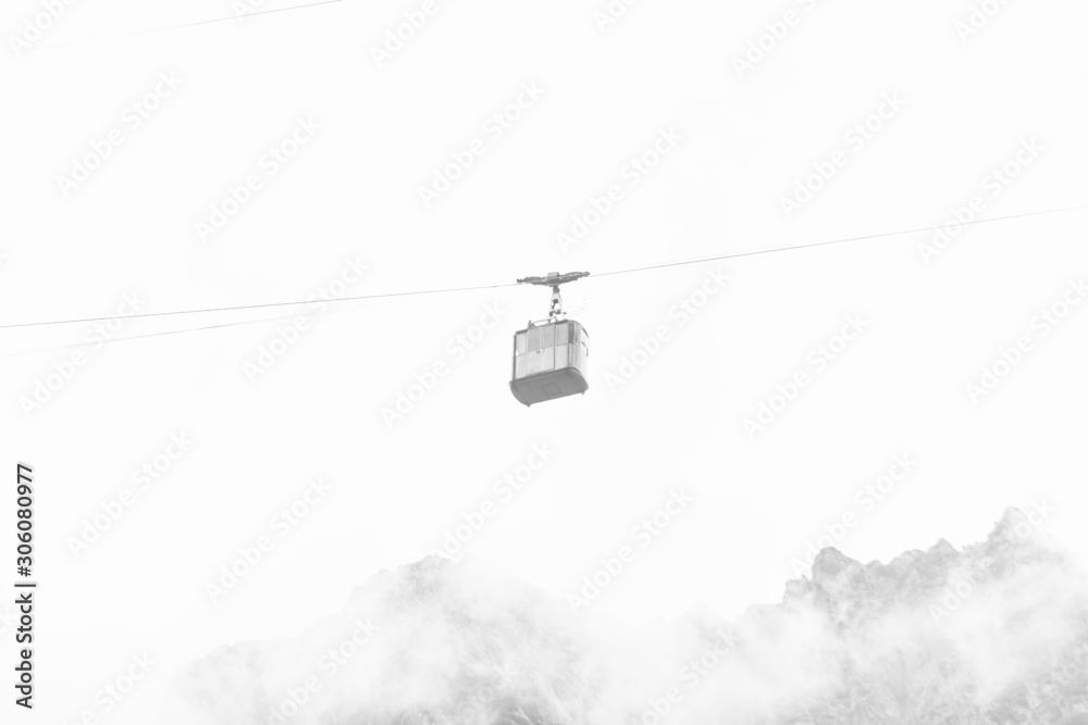 Funicular with cable car among misty foggy highland Funicular with cable car among misty foggy highland
