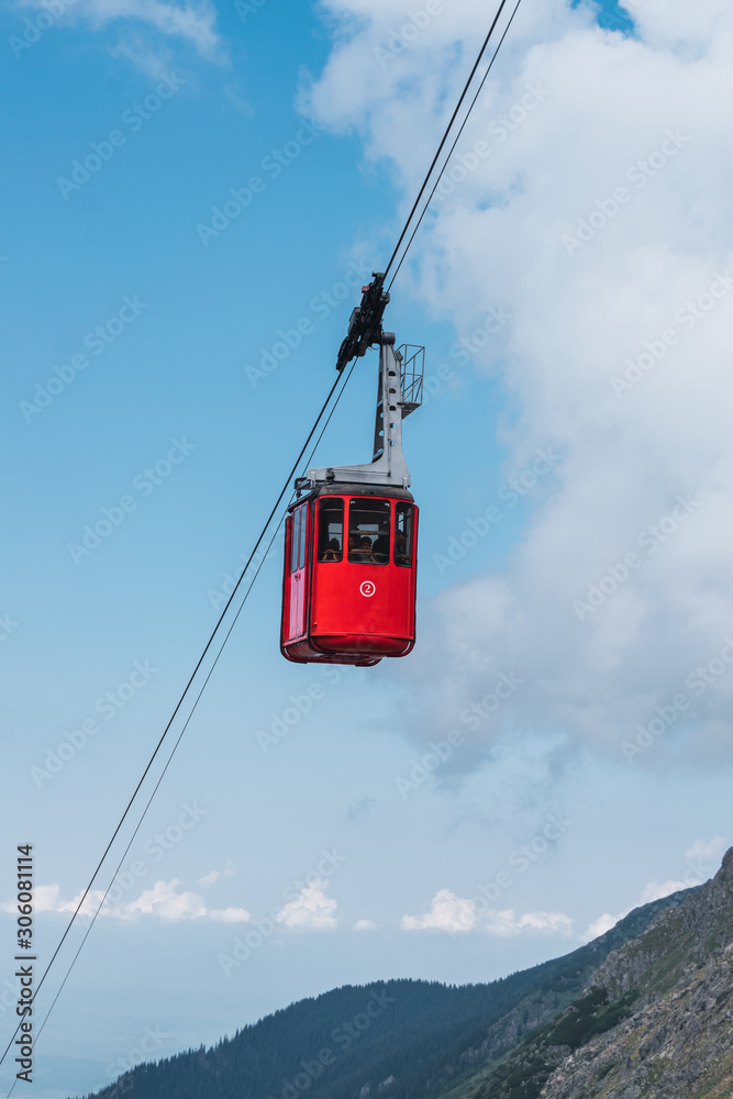 Cable railway among highland country and blue sky