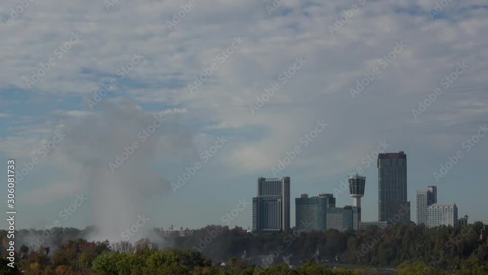Niagara, United States - October 19, 2019: 4K. Distant aerial view of the water that raise the Niagara Falls to the sky. Niagara Falls can be seen from Toronto and Niagara. Niagara, United States - October 19, 2019: 4K. Distant aerial view of the water that raise the Niagara Falls to the sky. Niagara Falls can be seen from Toronto and Niagara.