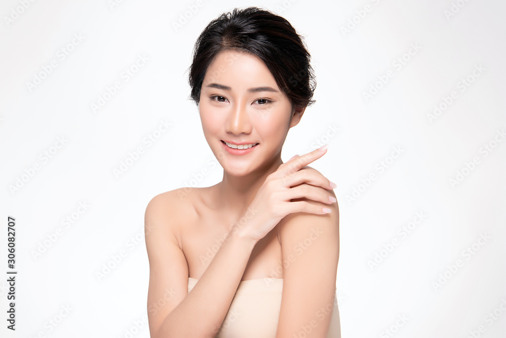 Beautiful Young Asian Woman hand Touching on Shoulder. Clean and Fresh skin, on white background, Beauty Cosmetology Concept Beautiful Young Asian Woman hand Touching on Shoulder. Clean and Fresh skin, on white background, Beauty Cosmetology Concept