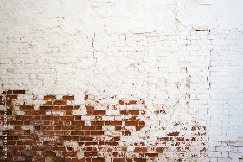 white painted aging brick wall