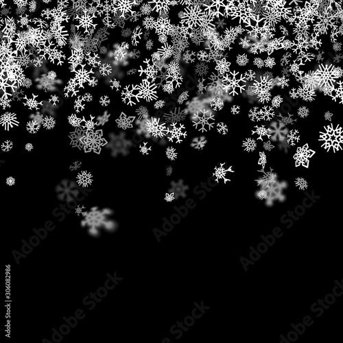 Snowfall background with snowflakes blurred in the dark