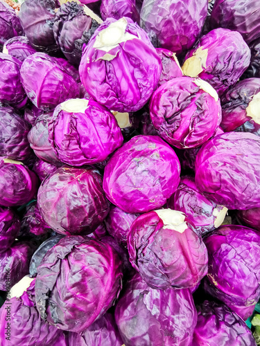 Purple cabbage stacked at the farmers market