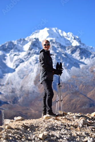 Woman standing on top of a mountain in Langtang National Park, Nepal