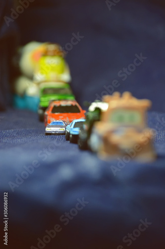 Cork cars. Toy cars on blue material. © Arhun