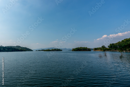 beautiful blue sky green forest mountains lake view at Kaeng Krachan National Park, Thailand. an idea for backpacker hiking on long weekend or a couple, family holiday activity camping relaxing