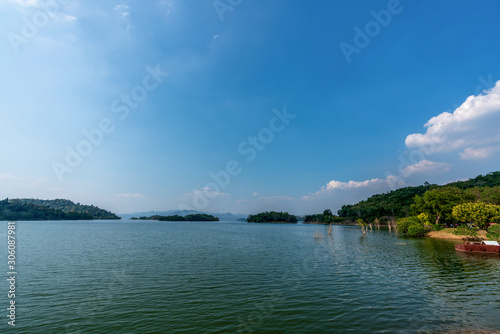 beautiful blue sky green forest mountains lake view at Kaeng Krachan National Park, Thailand. an idea for backpacker hiking on long weekend or a couple, family holiday activity camping relaxing