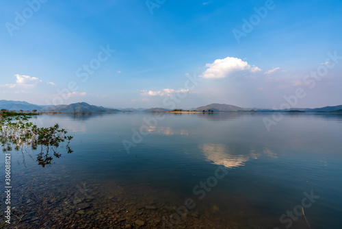 beautiful blue sky green forest mountains lake view at Kaeng Krachan National Park, Thailand.  an idea for backpacker hiking on long weekend or a couple, family holiday activity camping relaxing