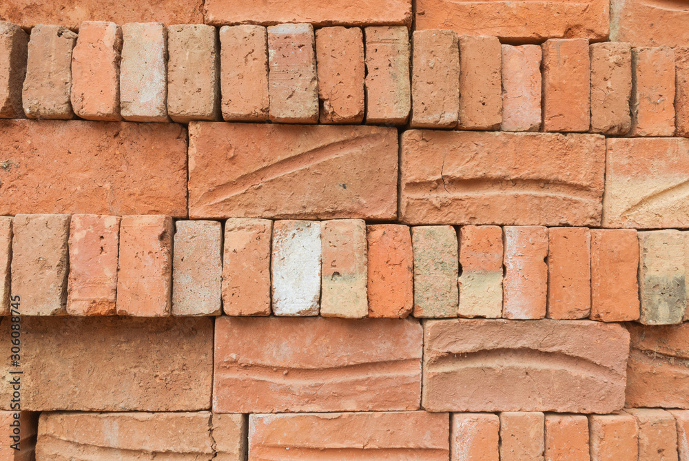 Obraz premium Old red brick stacked wall background texture