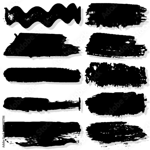 Strokes with a dry brush. Vector texture of paint spots. Set of grunge blots. The template for the background. Black ink isolated on white