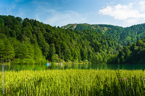 Unidentified people rowing in a boat in Savsat Karagol Nature Park in Blackse...