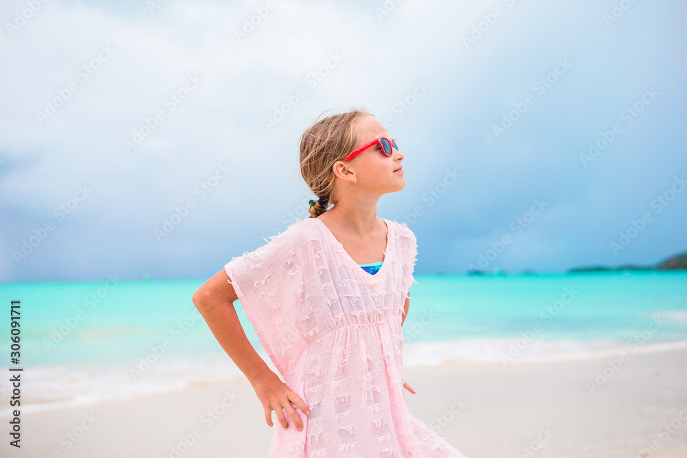 Portrait of beautiful girl on the beach dancing Portrait of beautiful girl on the beach dancing